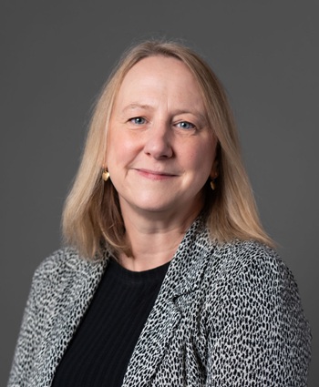 Headshot of person with grey background